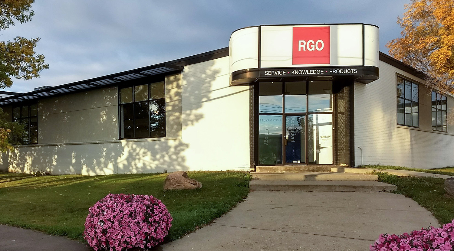 RGO Edmonton office, composed of white bricks with a black trim leading to an entrance with a large overhang displaying RGO logo