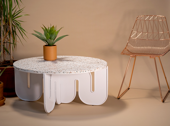 Bend Goods, copper Lucy wire chair with a white wavy table