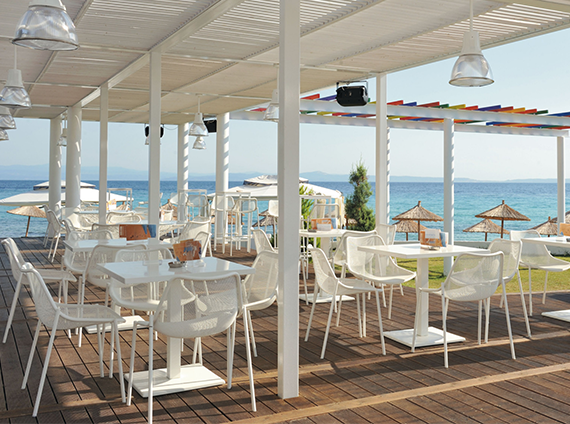 EMU Ronda, steel mesh side chairs, at tables, all in white