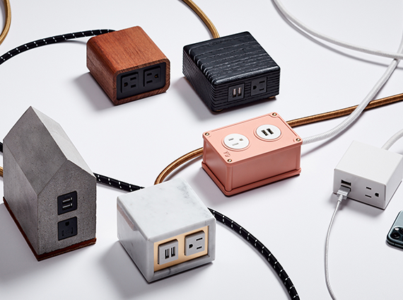 Various colored and uniquely shaped electrical outlets on a white table