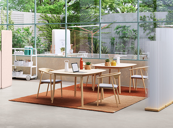 Light toned timber, ergonomic Leva chair with bent arms and a slight incline next to a square Branca table with rounded edges and inclined legs