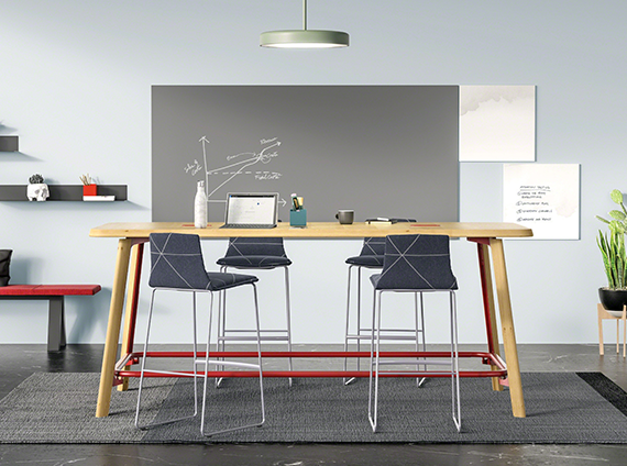 PolyVision grey ceramic writing board, in a room with a tall meeting desk and chairs