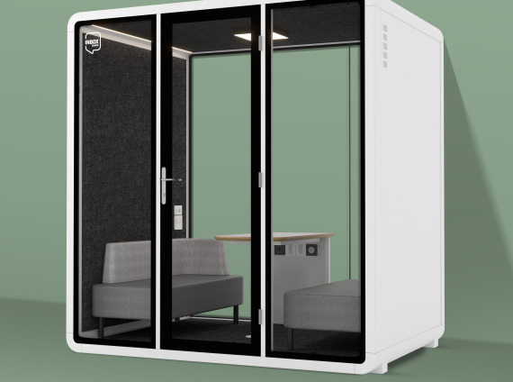 Quad Phone booth in front of a green wall