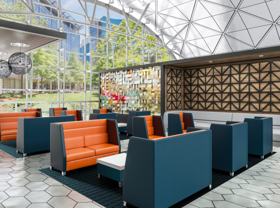 A series of single and double booth seating in a glass dome space